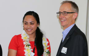 Tupu Tai intern Robyn Lesatele is congratulated by MBIE CEO David Smol