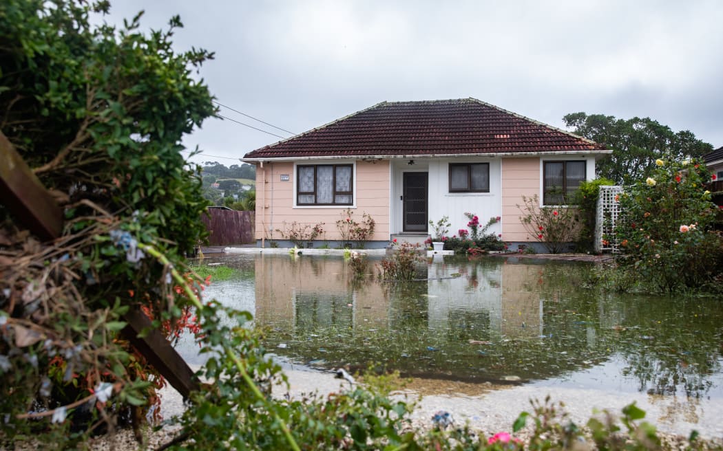 The home of Kannan Thiru was surrounded by a large pool of water still on Wednesday afternoon.
