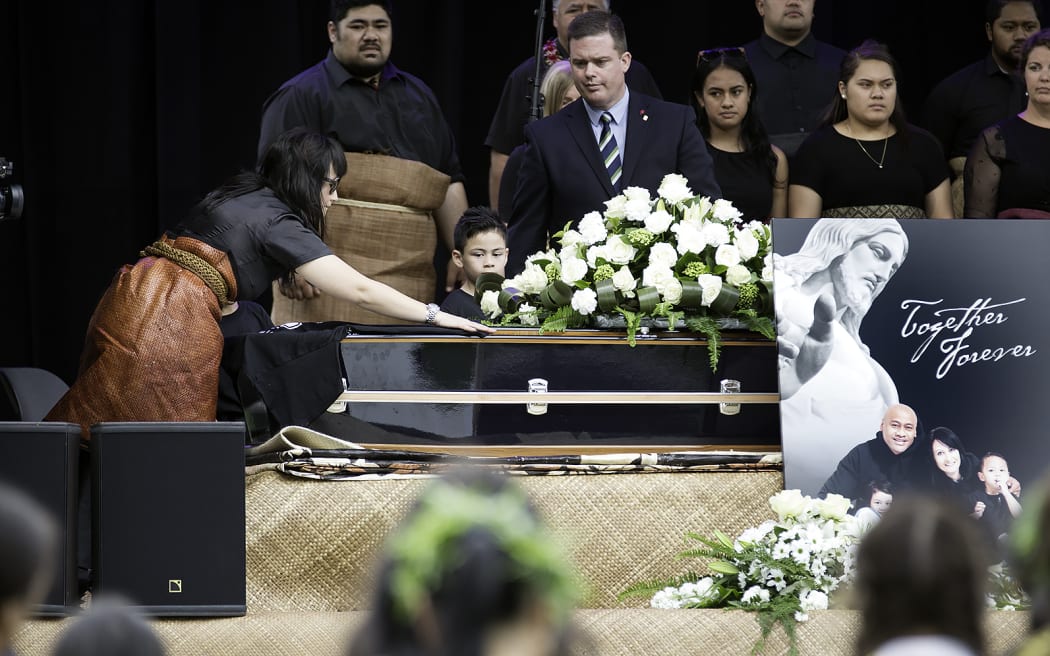 Jonah Lomu's family surround his casket at the Eden Park memorial service
