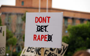 An anti-rape protest sign.