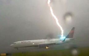 A plane being hit by lightning while on the tarmac the Atlanta Hartsfield Airport, Georgia, United States in 2015.