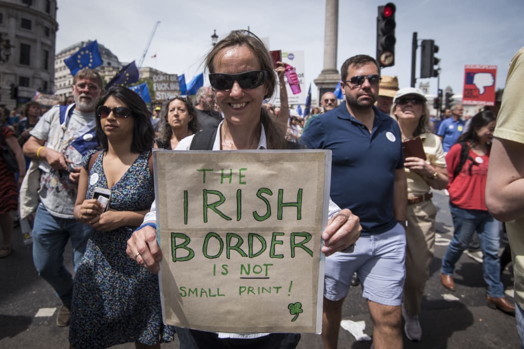A protester holds a signs expressing her concerns regarding the Irish border at the people's vote march in London, United Kingdom where thousands rallied to protest against Brexit on June 23 and ask for a referendum on the final Brexit deal.