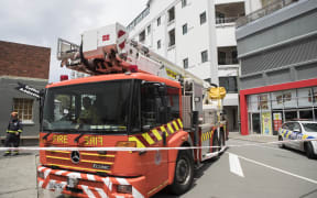 Emergency service outside Tennyson Apartments on Tennyson St, Wellington. The apartments have been evacuated because of structural damage.