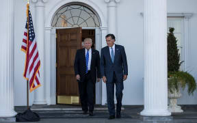 Donald Trump and Mitt Romney leave the clubhouse after their meeting at Trump International Golf Club in New Jersey.
