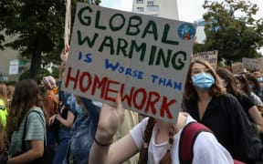 Young protesters with pro-climate banners are seen in Gdansk, Poland, on 25 September 2020