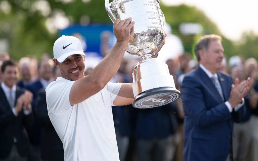 Brooks Koepka with the US PGA Championship trophy, 2023.