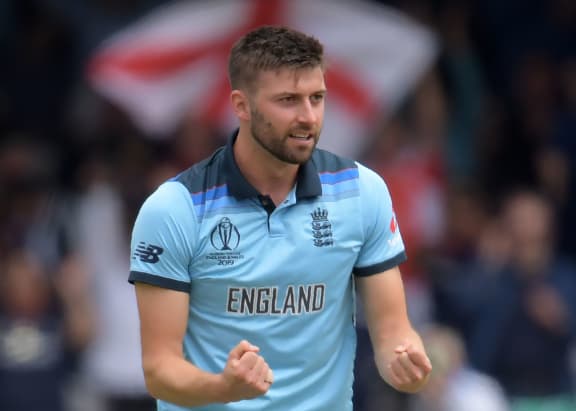 England's Mark Wood celebrates after dismissing New Zealand's Ross Taylor during the 2019 Cricket World Cup final between England and New Zealand at Lord's Cricket Ground in London on July 14, 2019. (July by Dibyangshu Sarkar / AFP) / EDITORIAL USE ONLY