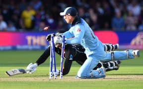 England's Jos Buttler runs out New Zealand's Martin Guptill to win the super-over to win the 2019 Cricket World Cup final.