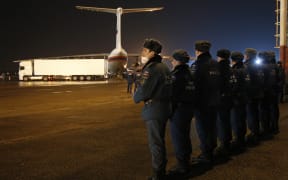 Russian Ministry for Emergency Situations employees prepare to load the bodies of the victims from the ministry's plane at the airport in St Petersburg.