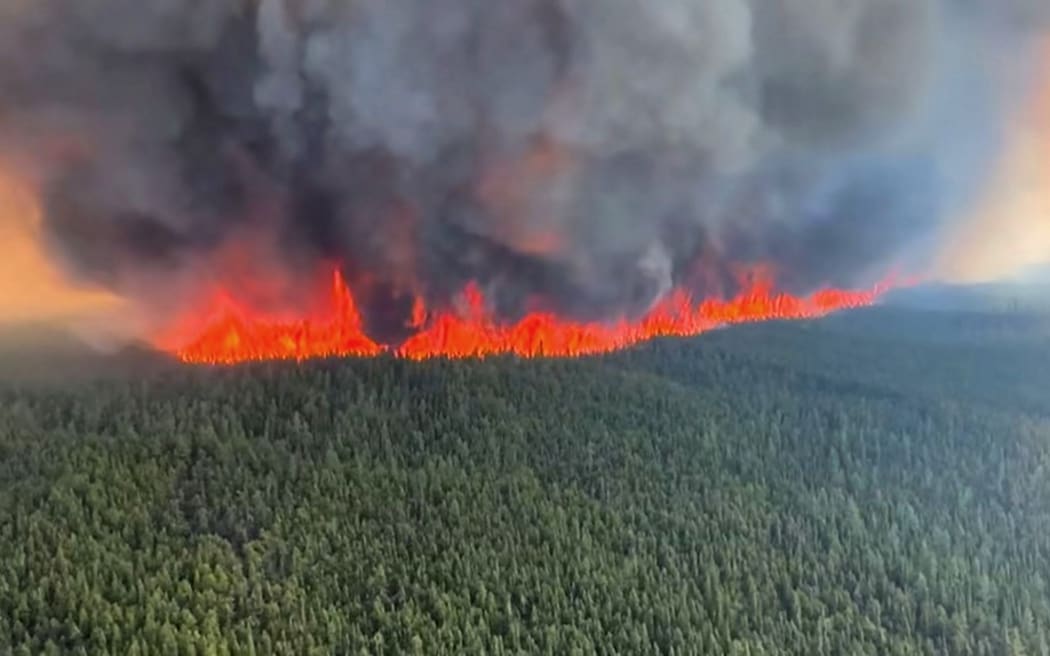 This June 8, 2023, handout still image from a video by British Columbia Wildfire Service, shows an aerial view of the West Kiskatinaw River wildfire located 10kms (6 miles) east of Tumbler Ridge, Canada.