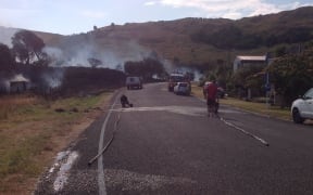 Photo shows how close fire got to houses, with just the road in between.