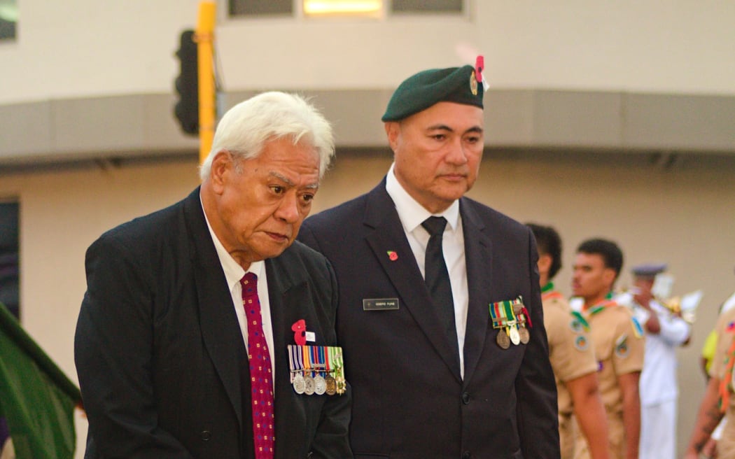 Samoa Deputy Prime Minister Tuala Tevaga Ponfasio (right) stands alongside a veteran 