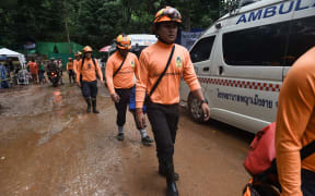 Rescue workers are seen at the Tham Luang cave.