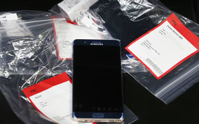 Several Samsung Galaxy Note 7s lay on a counter in plastic bags after they were returned to a Best Buy in the US.