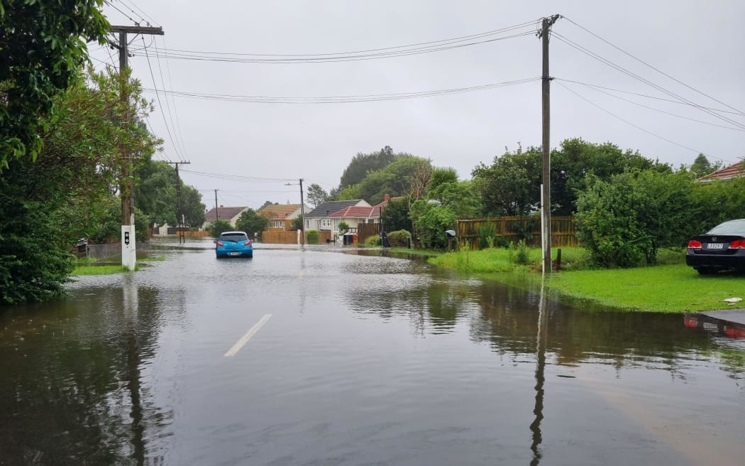 A flooded street in Mt Roskill, on 1 Febuary 2023
