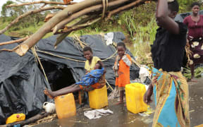 Survivors of Cyclone Idai in a makeshift shelter by the roadside near Nhamatanda about 50 kilometres from Beira, in Mozambique,