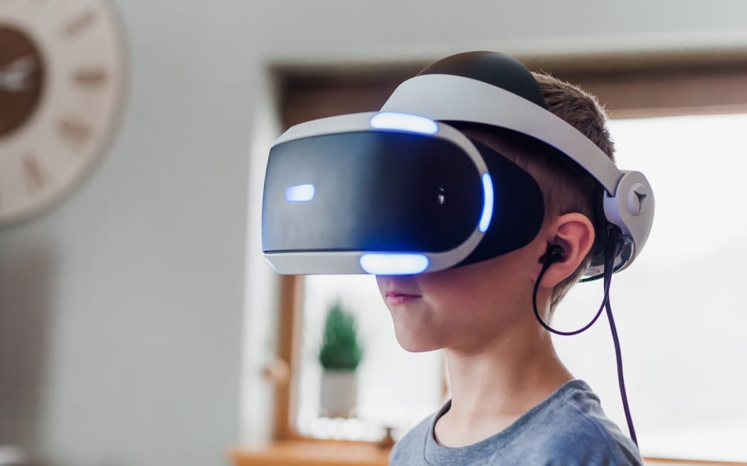 a child wearing a virtual reality headset