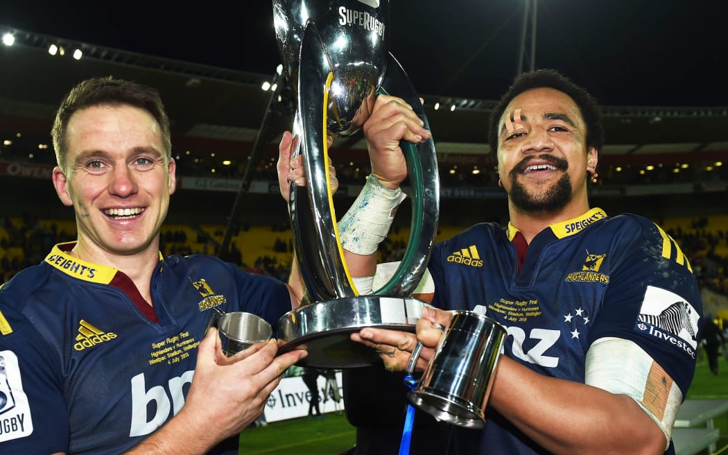 Ben Smith and Nasi Manu hold the Super Rugby trophy aloft after the Highlanders historic win.