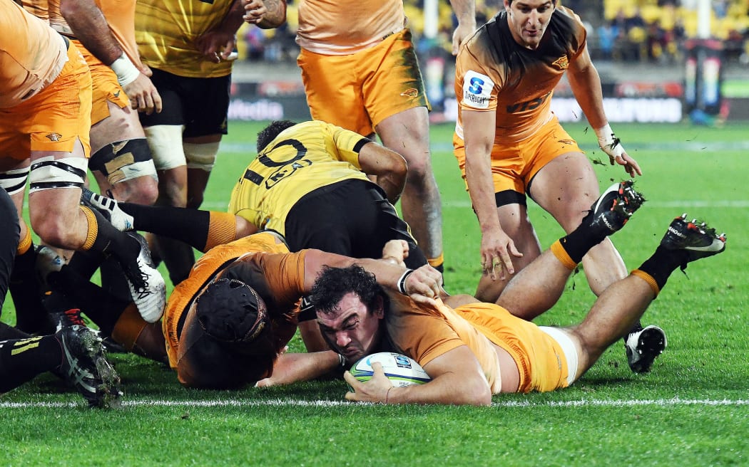 Jaguares Agustin Creevy scores a try against the Hurricanes.