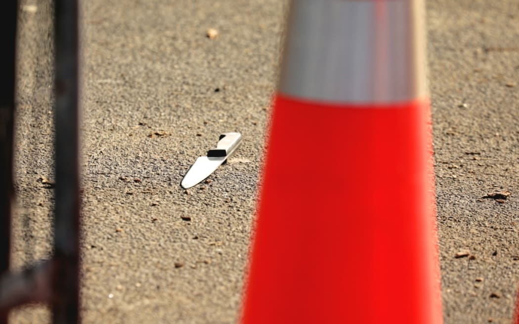 A knife on the ground after an incident at Murrays Bay on the North Shore on 23 June 2022.