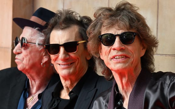 (L-R) Keith Richards, Ron Wood and Mick Jagger of legendary British rock band, The Rolling Stones pose as they arrive to attend a launch event for their new album, "Hackney Diamonds" at Hackney Empire in London on September 6, 2023, their first album of original material since 2005. The Rolling Stones will on Wednesday, September 6, reveal details of "Hackney Diamonds", the band's first studio album of new music since 2005, at a launch event in east London. (Photo by Daniel LEAL / AFP)