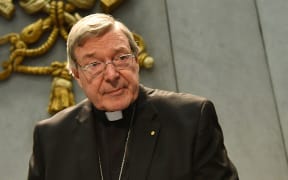 Australian Cardinal George Pell looks on as he makes a statement at the Holy See Press Office in the Vatican City.
