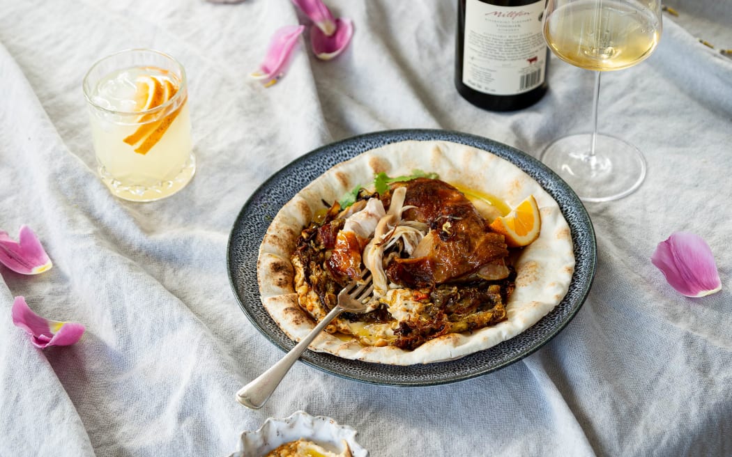 Palestinian roast chicken with melted onions, hummus and lemony