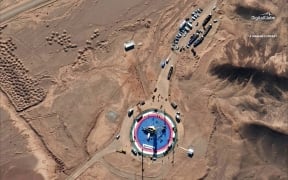 This Feb. 5, 2019, satellite image provided by DigitalGlobeÂ shows a missile on a launch pad and activity at the Imam Khomeini Space Center in Iran's Semnan province.