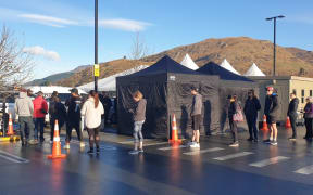 People queue at the one-day drive-through Covid-19 testing clinic in Frankton, operating from 9am to 5pm on Tuesday.