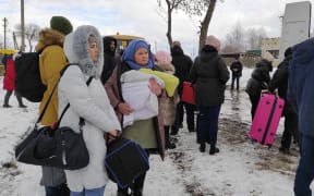 SUMY, UKRAINE - MARCH 8: (----EDITORIAL USE ONLY â MANDATORY CREDIT - "UKRAINIAN PRESIDENCY / HANDOUT" - NO MARKETING NO ADVERTISING CAMPAIGNS - DISTRIBUTED AS A SERVICE TO CLIENTS----) Civilians flee the city after temporary ceasefire announced on March 8, 2022 in Sumy, Ukraine.