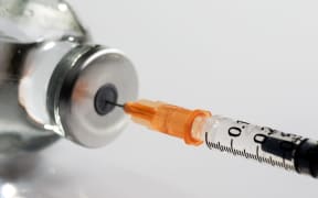 A generic picture of a vaccine, needle.