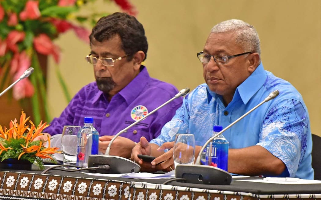 Robin Nair (L) when he was Permanent Secretary for Foreign Affairs and Fiji Prime Minister Frank Bainimarama at prepartory talks for the UN Oceans Conference