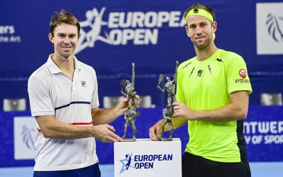 Australian John Peers and New-Zealand's Michael Venus pose with the European Open doubles title after beating Indian Bopanna and Dutch Middelkoop in the final in Antwerp.