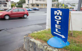 A sign advertising a local motel in Auckland