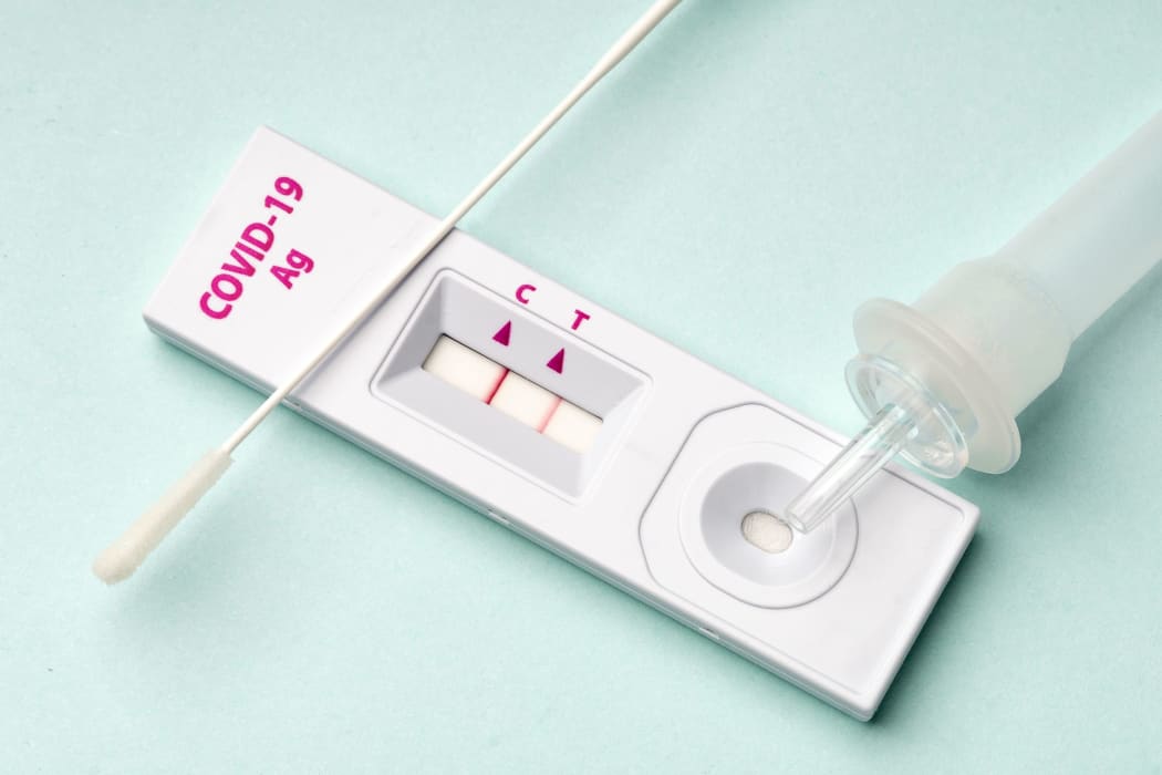 Rapid test device for COVID-19 virus with a positive result.