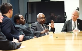 The secretary-general of the United Liberation Movement for West Papua, Octo Mote (centre) and the Movement's Pacific regional ambassador Akaboo Amatus Douw to his right, talk to New Zealand MPs, Wellington 2015.