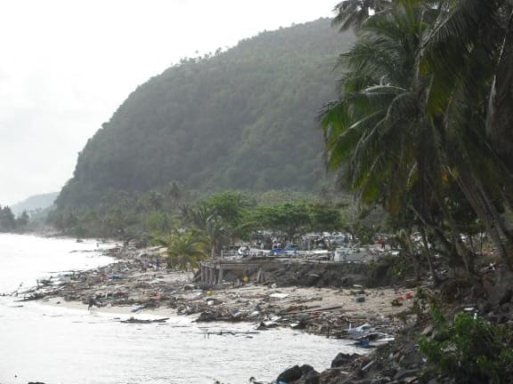 Debris strewn along the shoreline following the tsunami.