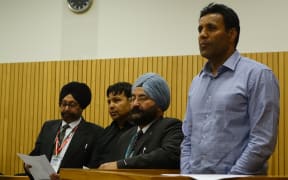 Jaswinder Singh (right) and Satnam Singh (second from left), with two interpreters, at the High Court in Nelson on Monday 9 November.