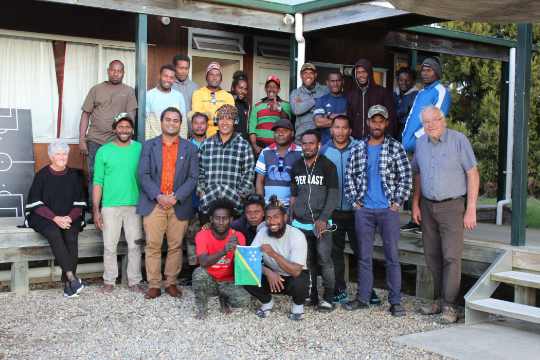 Solomon Islands seasonal workers in Nelson, New Zealand with their employers (first and last in second row) and Solomons' acting high commissioner to New Zealand, John Kemakeza (third in second row with orange shirt). 2020