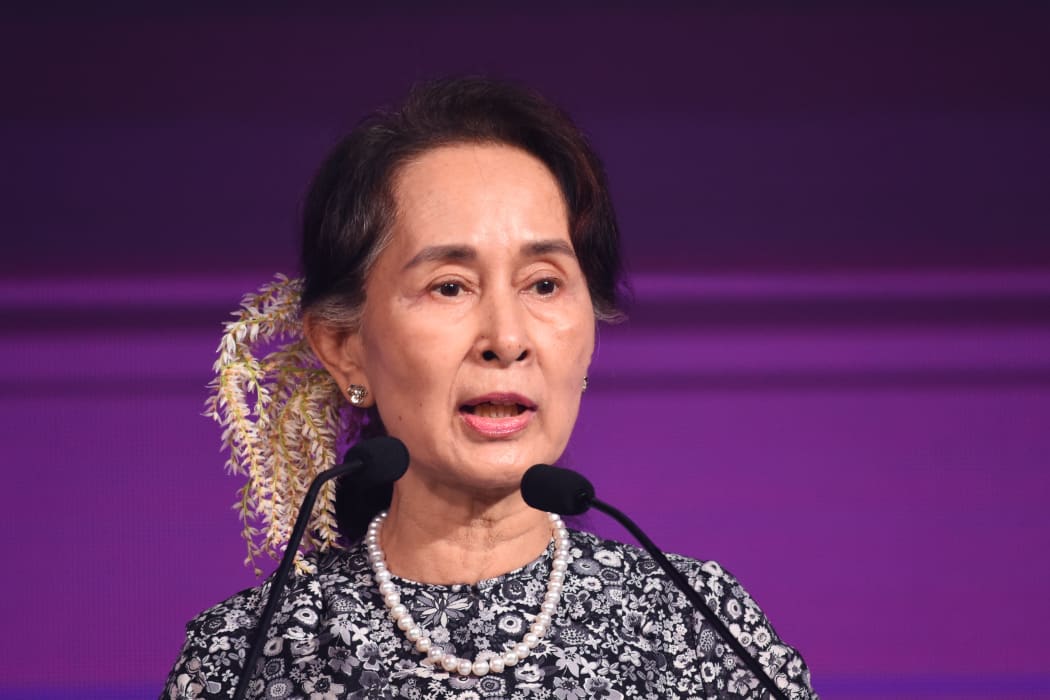 Myanmar State Counsellor Aung San Suu Kyi speaks at a business forum on the sidelines of the 33rd Association of Southeast Asian Nations (ASEAN) summit in Singapore on November 12, 2018. (Photo by Roslan RAHMAN / AFP)