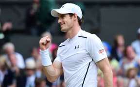 Andy Murray celebrates beating Australia's Nick Kyrgios on the eighth day of the 2016 Wimbledon Championships at The All England Lawn Tennis Club in Wimbledon, southwest London, on July 4, 2016. 
LEON NEAL / AFP
