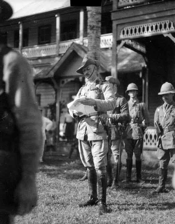 “Administrator of Samoa, Colonel Robert Logan, reading a Proclamation of occupation at the flag-raising ceremony in Apia on 30 August 1914 (31 August Eastern time). This was the morning after the occupation of German Samoa by the New Zealand Expeditionary Force.”