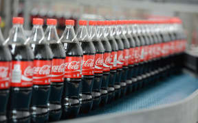 Bottles of Coca-Cola on a production line.