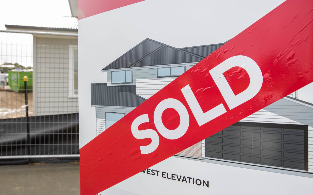 Sold sign outside a new house being built in East Auckland