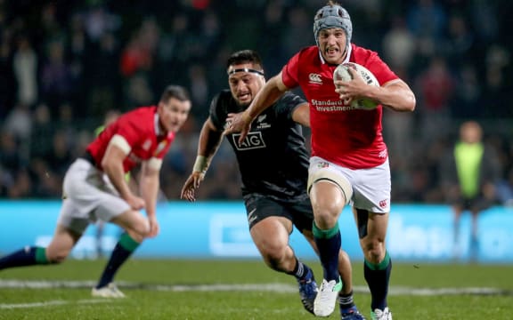 Jonathan Davies makes a break for the Lions.