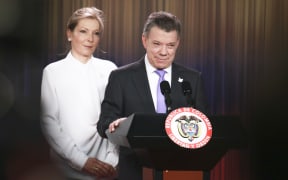 President of Colombia Juan Manuel Santos delivers a speech next to his wife Maria Clemencia Rodriguez in Bogota, Colombia, after being awarded with the Nobel Peace Prize.