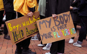 People gathered on Courtenay Place in Wellington to rally against sexual violence.
