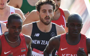 Julian Matthews (centre) contests the 1500m heats at the Glasgow Commonwealth Games.