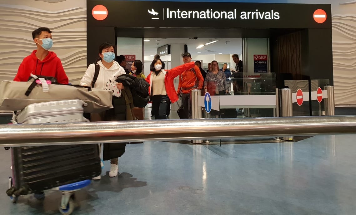 Passengers from international flights at Auckland Airport on Monday 27 January, after flights from Guangzhou and Shanghai had touched down. Some people were wearing masks.