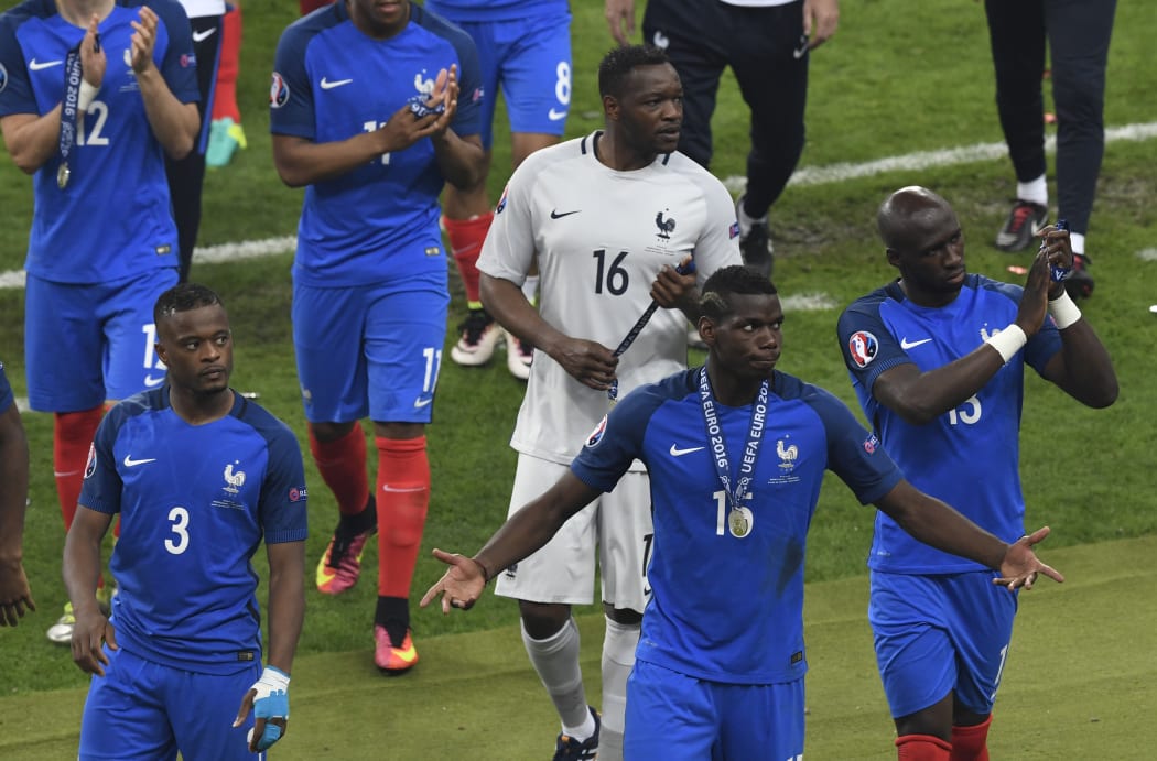 France players (from left) defender Patrice Evra, goalkeeper Steve Mandanda, midfielder Paul Pogba and defender Eliaquim Mangala after the team's defeat.